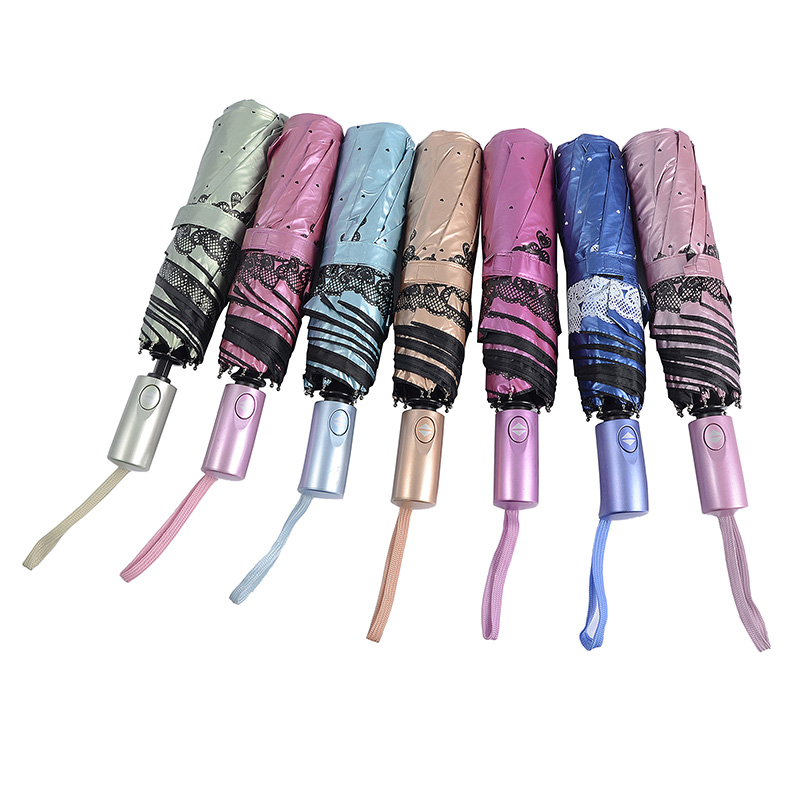 Růžový uv barevný materiál s potiskem 3násobného deštníku plně otevřený