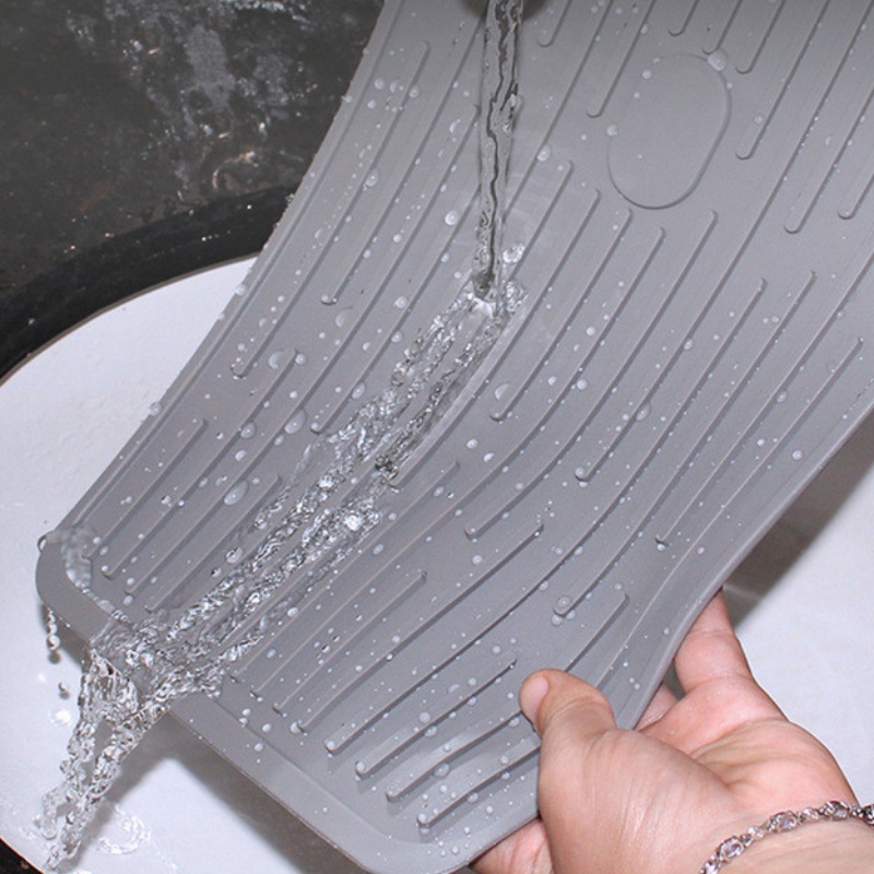 Obdélníkové tlačítko k uchycení odtokové vložky