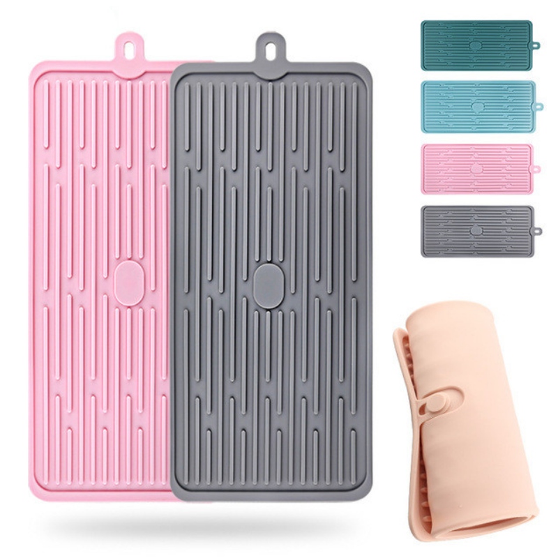 Obdélníkové tlačítko k uchycení odtokové vložky